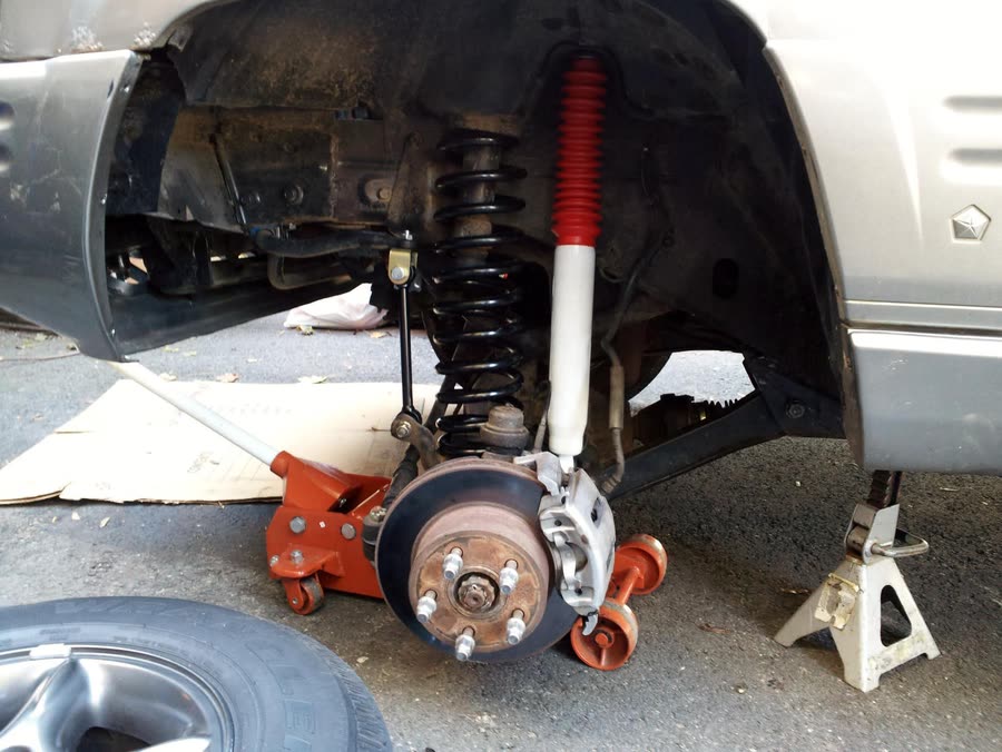 New shock absorber and coil spring installed in a vehicle's front suspension